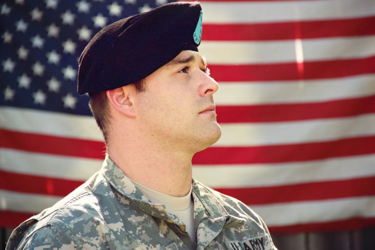 U.S. Army soldier before American flag