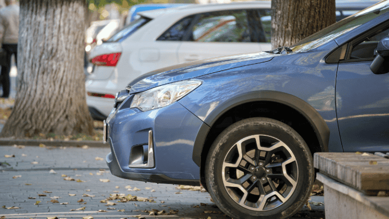 A parked blue car belonging to an active service member.