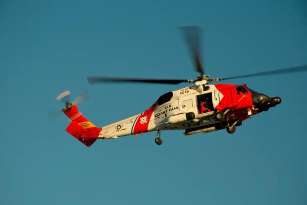 Coast Guard helicopter flying during a rescue operation