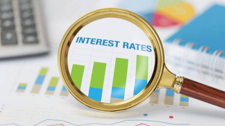 A magnifying glass highlighting a bar graph labeled "Interest Rates," representing the visualization of interest rate trends and financial data.