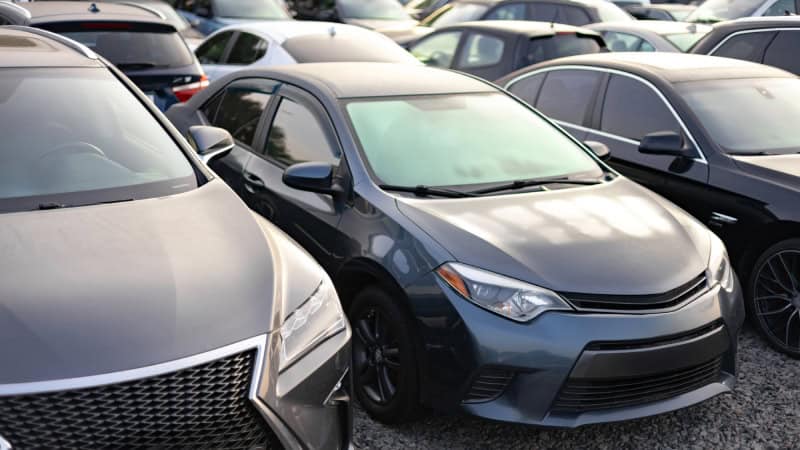 Vehicles parked in a vehicle storage facility impound lot