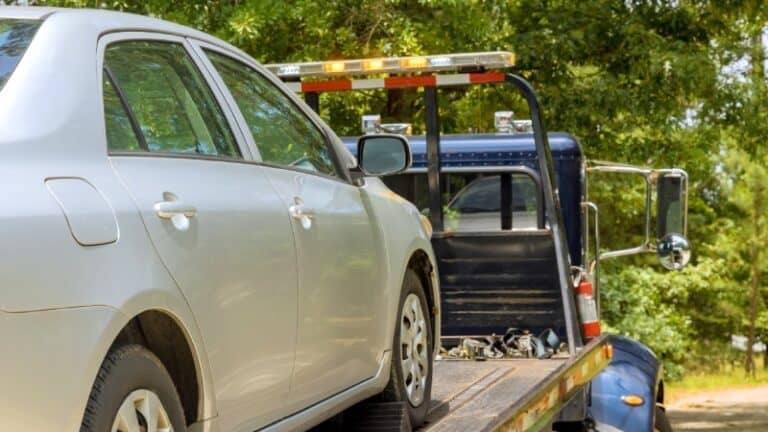 Tow truck loading a vehicle during lien sale or repossession process