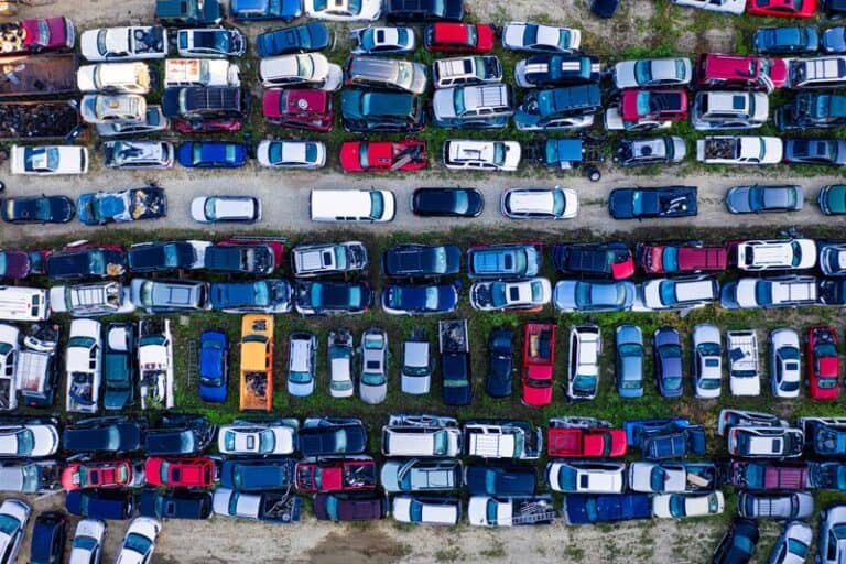 abandoned cars in a tow lot