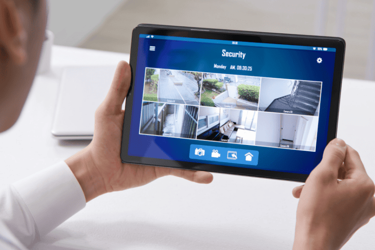 Man watching home security footage from tablet